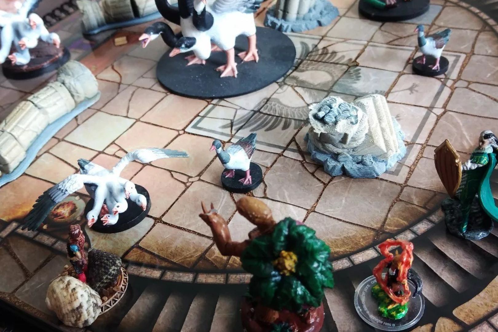 Handpainted D & D figurines on a gridded map